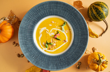 pumpkin cream soup with herbs and seeds