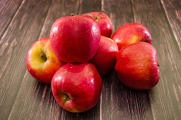 red apples on a wooden table