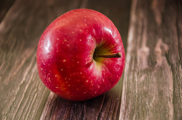 red apple on the table. Close-up.
