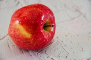 red apple on the table. Close-up.