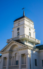Fototapeta na wymiar Minsk/Belarus - October 23 2019: City Hall of Minsk. Medieval clock tower. Europe architecture. Beautiful clean buildings.
