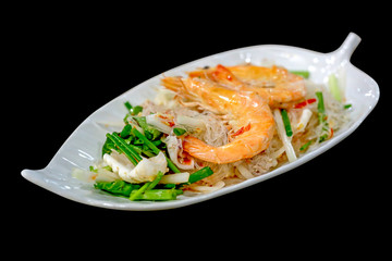 Shrimp Vermicelli Salad sea food or Spicy Salad on black background, focus selective.