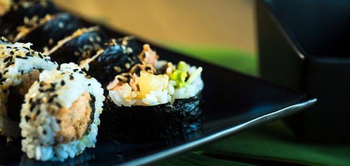 Japanese sushi set. Maki and rolls with tuna, salmon, shrimp, mango, crab and avocado