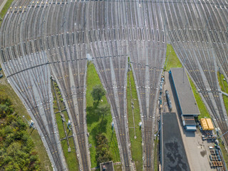 Aerial view of freight train wagons on large railway track field. Concept of modern logistics.
