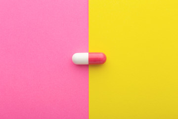 Pharmaceutical pill, pink white capsule
