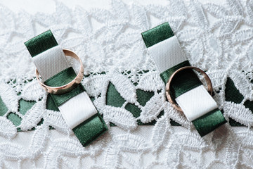 wedding rings on a small pillow. rings with gold