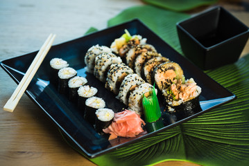 Japanese sushi set. Maki and rolls with tuna, salmon, shrimp, mango, crab and avocado