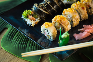 Japanese sushi set. Maki and rolls with tuna, salmon, shrimp, mango, crab and avocado
