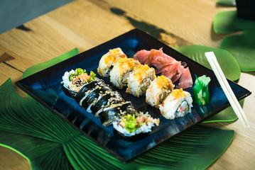 Japanese sushi set. Maki and rolls with tuna, salmon, shrimp, mango, crab and avocado