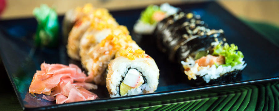 Japanese sushi set. Maki and rolls with tuna, salmon, shrimp, mango, crab and avocado