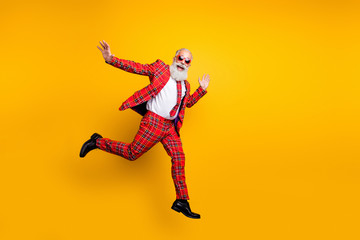 Full length photo of funny hipster grandpa white beard guy jumping high exciting trip wear plaid...
