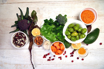 Assortment of foods for healthy liver on white wooden background. Detox nutrition after alcohol and...