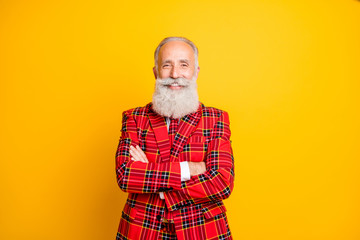 Photo of cool modern grandpa guy with crossed hands toothy smiling unusual party character role play wear red blazer tie clothes isolated yellow color background