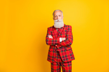 Portrait of his he nice attractive well-dressed content imposing gray-haired man wearing checkered jacket crossed hands newyear isolated over bright vivid shine vibrant yellow color background