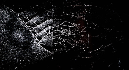 Man hand holding mobile phone with broken screen