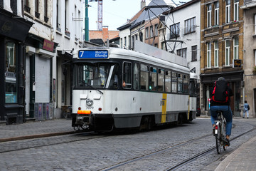 Fototapeta na wymiar Antwerp old gothic street with railway for tram with reflect of light geometry lines