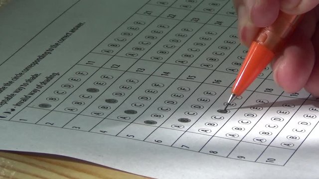 Student Answering an Exam Paper