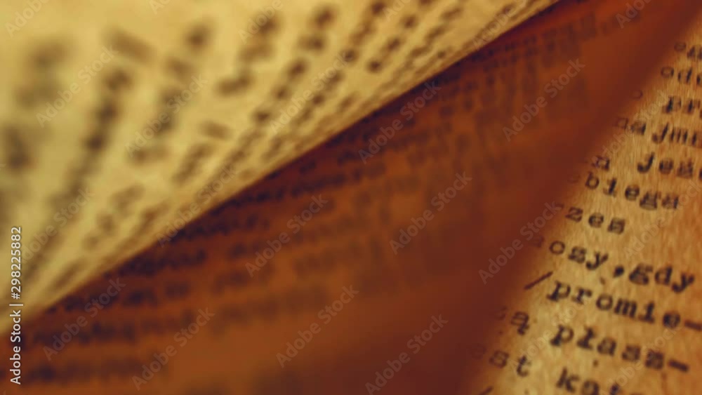 Aufkleber flicking through old typescript technical book pages close-up