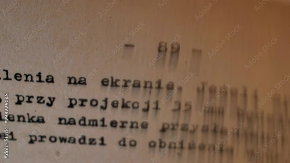 Aufkleber flicking through old typescript book page numbers close-up