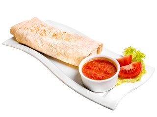 Eastern traditional shawarma plate with sauce isolated on white.