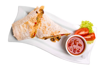 Eastern traditional shawarma plate with sauce isolated on white. Top view.