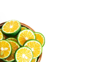 thin slices of green natural fresh mandarin orange in a wooden plate
