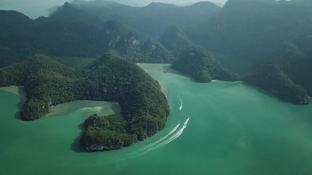 Aerial From above tropic Island Unique attraction Lake Pregnant Maiden. Nature landscape. Mountains cliffs Rain forest Green sea water Boats. Malaysia Langkawi. Landmark Travel. Helicopter.