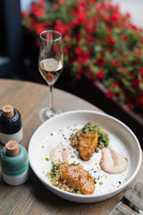 Miso Glazed Cod Fish with Quinoa and Spinach as Side Dish on White Plate. Lunch Served at Restaurant.