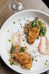 Miso Glazed Cod Fish with Quinoa and Spinach as Side Dish on White Plate.