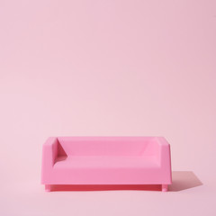 Pink sofa in all pink room. Trendy minimal interior.