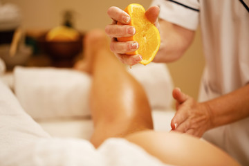 Close-up of orange massage at the spa.