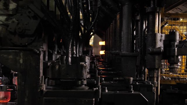 The process of making glass bottles in slowmotion glassworks