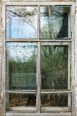 Old white wooden window frame in the daytime