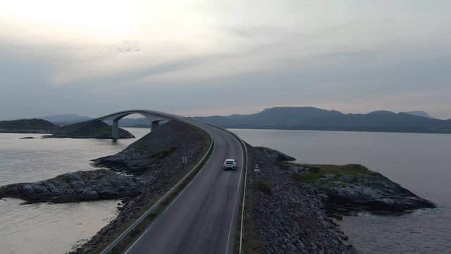 Aerial view of a car driving  on Atlantic Ocean Road in Norway