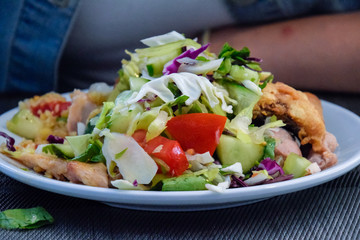 assorted salad with cucumbers and purple leaflets