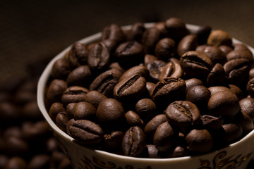  coffee bean filled mug , close up . coffee beans background 
