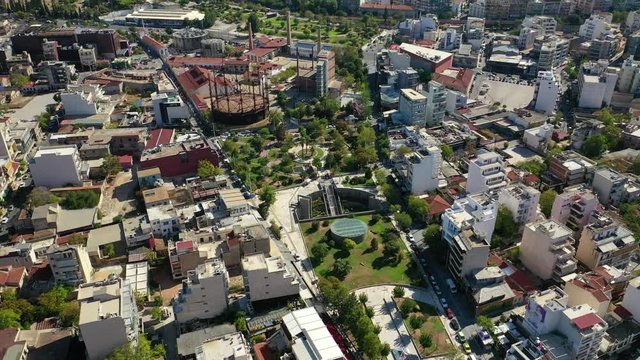 Aerial drone video of famous urban public area of Gazi and Kerameikos in the heart of Athens, Attica, Greece