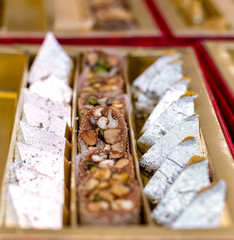 A mixture of various Indian sweets packed in a box. Peda, laddu, mithai, diwali sweets