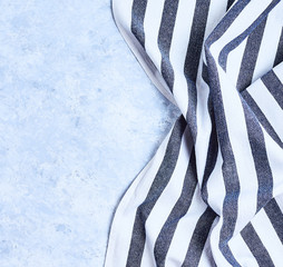 striped blue and white kitchen towel. Isolated on white background