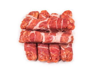Chevapchichi in bacon isolated on white background.