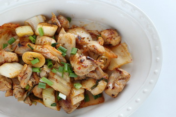 Korean food, chicken and kimchi stir fried with leek