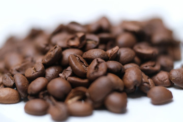 Coffe beans white background, shallow depth of field