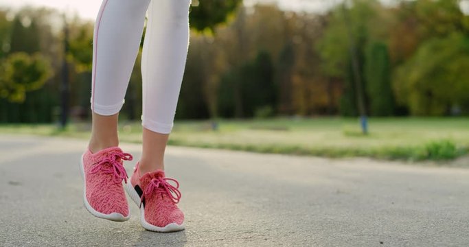 Handheld view of woman’s legs starting up her jogging training