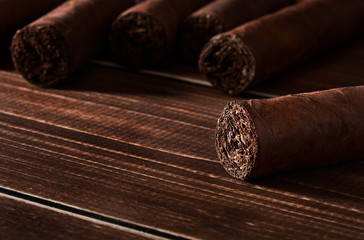 Still life with cuban cigar on old wooden board table with space for text