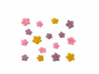 Naklejka premium Beautiful flowers made from pastel colored plasticine clay on white background, variety colours floral are dough
