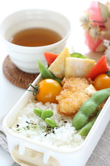 Japanese food, edamame soy bean and cutlet with tomato lunch box