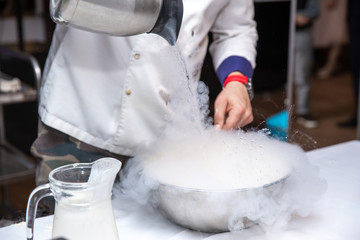 Chef is cooking ice cream with liquid nitrogen