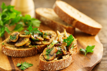 Bruschetta with fried mushrooms with onions and parsley.