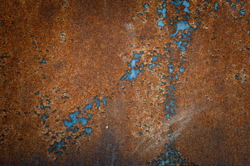 Fragment of an old rusty metal sheet