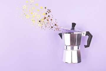 Creative shot of confetti pouring out of coffee maker. Abstract background. Copy space.